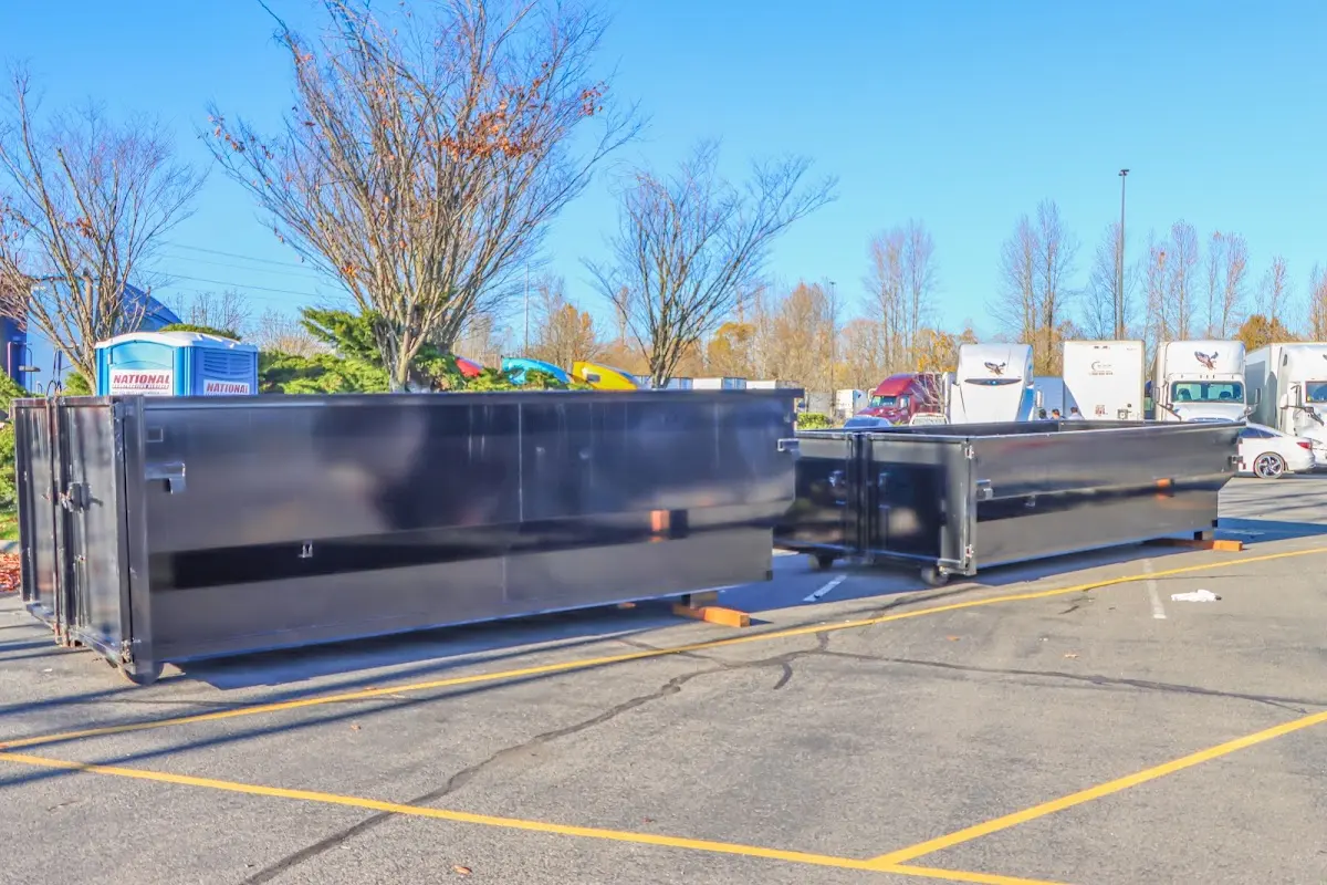 Professional dumpster rental service with roll-off container on residential driveway in Lake Mary
